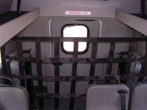 Image of the cargo netting inside the bus; large netting and very tall.