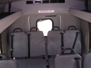 Interior of bus shown with all seating up.