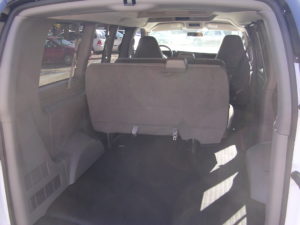 Inside of the rear of a fleet 8 passenger van.