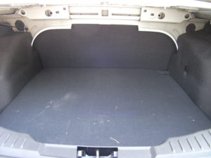 Inside of the trunk of a small fleet vehicle.