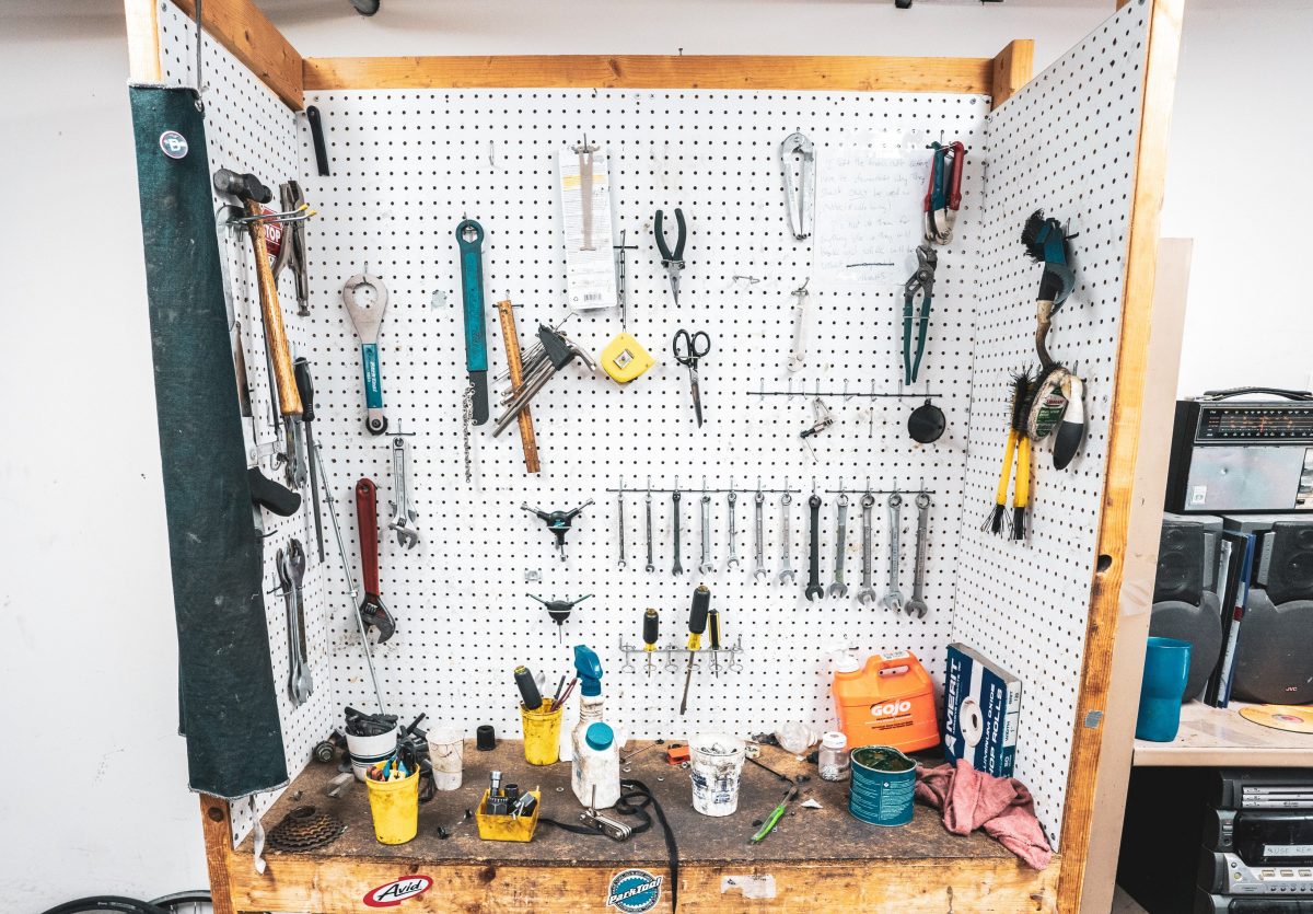 A photo of a tool bench with a collection of tools available for use with in the University Bicycle Resource center.