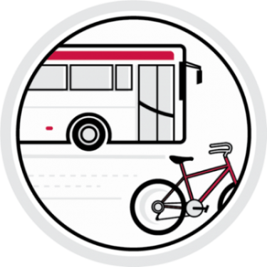 Red and white colored circular transportation icon, includes a bus and bicycle near each other on the road.