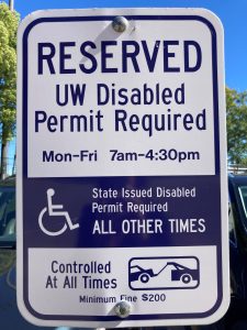 Photo of a UW parking stall reserved for annual and temporary UW-Disabled permit parking Monday through Friday, 7 am – 4:30 pm. After 4:30 pm, those with a DOT Disabled permit may also park in stalls with this sign.