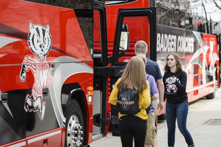 Photo of students boarding an intercity bus on the UW-Madison campus.